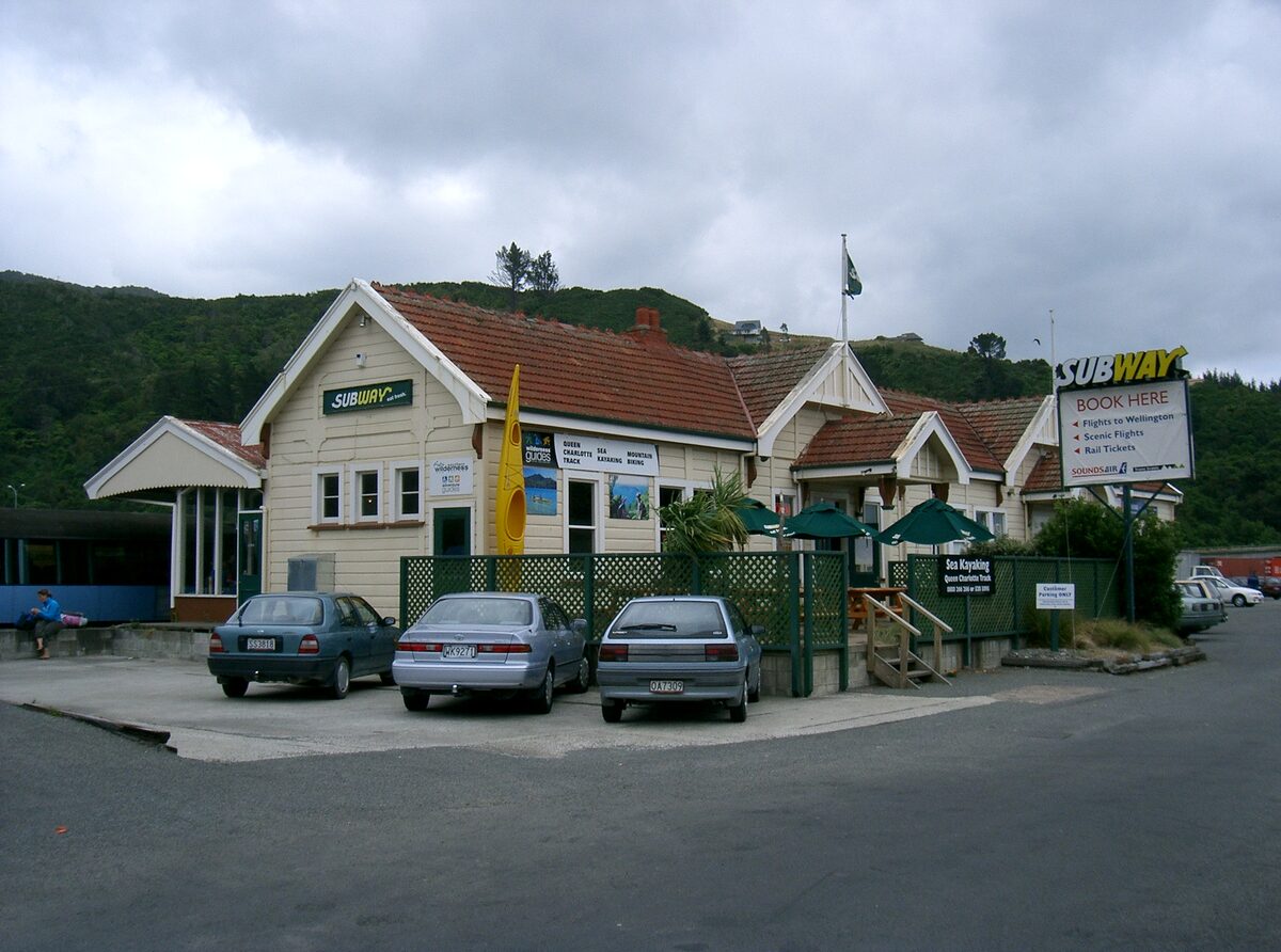Picton railway station building with Subway signs, seen from Auckland Street