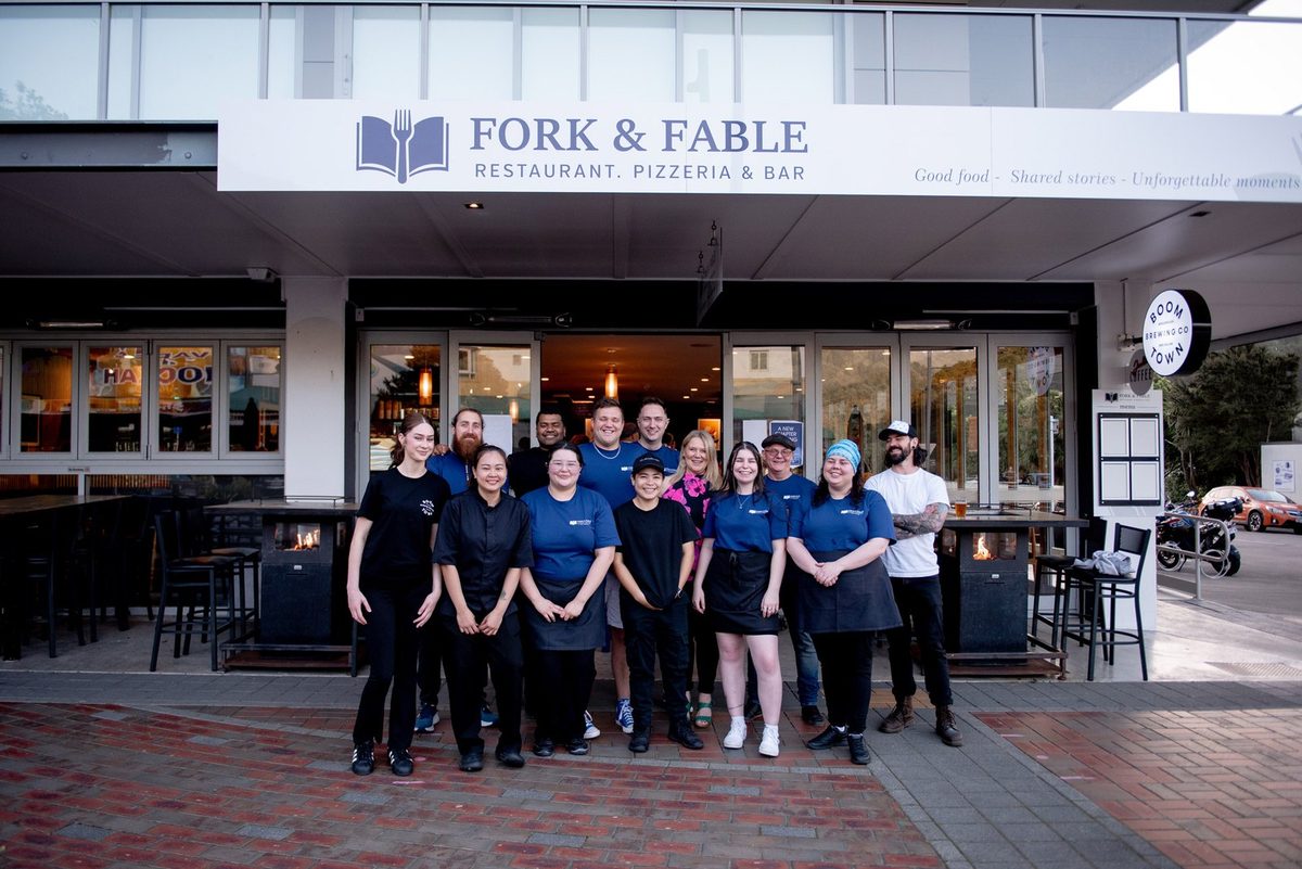 Fork & Fable staff standing outside the signed High Street restaurant frontage.
