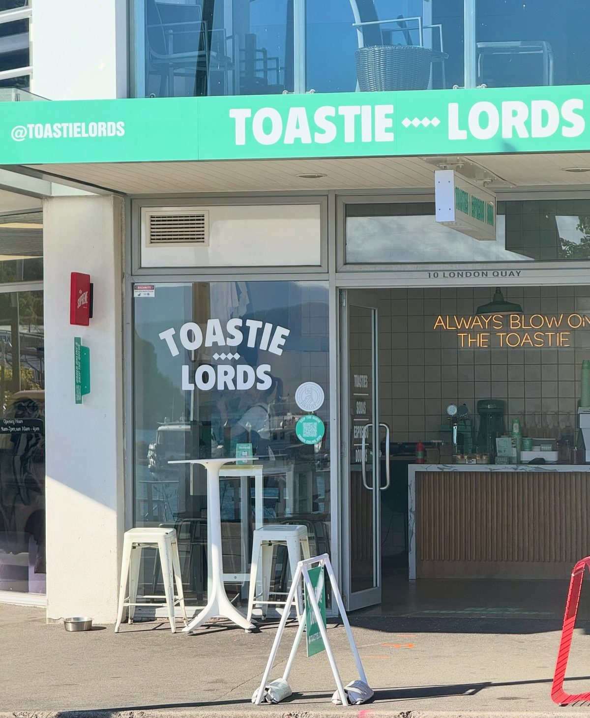 Toastie Lords storefront at 10 London Quay, with its green fascia, service counter and entrance visible.